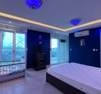 Interior with pendant lighting, a bed, and a crib in Unusual Properties.