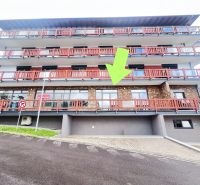 A building with balconies and a stone facade, commercial premises in Donovaly, Banská Bystrica district.