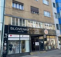 The building on Obchodná Street in Bratislava - Old Town with shops and a restaurant.