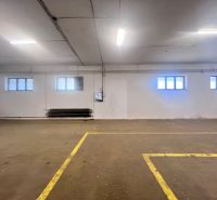 An empty hall with windows and floor markings. Warehouses and halls.