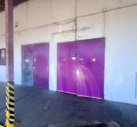 Purple doors leading to warehouses and halls on Zvolenská Street, Kráľová, Banská Bystrica.
