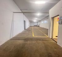 Interior of warehouses and halls with yellow lines on the floor, white walls, energy-efficient lighting.