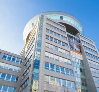 Office building on Plynárenská Street in Bratislava - Ružinov against the backdrop of a blue sky.