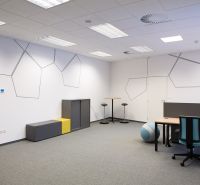 Offices with chairs, tables, and decorated walls, floor with wooden decor.