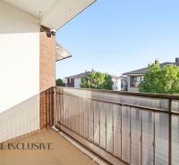 The balcony of a 3-room apartment in Dunajská Streda with a view of neighboring family houses.
