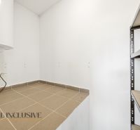 Storage space in a 3-room apartment with a boiler and a shelf for storage.