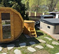 Sauna, hot tub, and jacuzzi in front of the cottage in Turík, Ružomberok district.