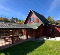 A cottage in Turík, Ružomberok district, Žilina region with a wooden terrace and garden.