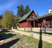 A wooden cottage surrounded by greenery in the recreational area of Turík, Ružomberok district, Žilina region.