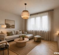 Living room in a 3-room apartment with a sofa, wooden decor flooring, and decorations.