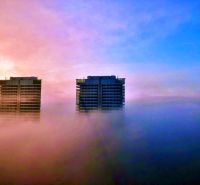 Skyscrapers in the morning mist offer a beautiful view on Továrenská Street, near the three-room apartment.