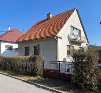 A family house in the village of Podháj, Kráľová, Banská Bystrica with a red roof and a garden.