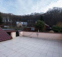 View from the terrace of a family house on Borinská Street in Marianka with a forest background.