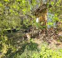 A garden in Košice - the district of Krásna on 1st May Street, surrounded by greenery and trees.