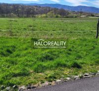 A green residential plot in Lutila surrounded by nature and hills on the horizon.