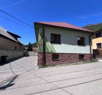 A family house in Švošov with a stone facade and a paved entrance.