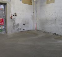 Spaces in warehouses and halls with concrete floors and worn-out walls.