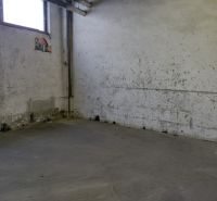 Industrial interior with worn walls and gray flooring, warehouses and halls.