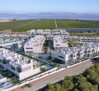 A view of a residential complex extending to the lagoon in Torrevieja, offering 2-bedroom apartments.
