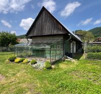 A family house in Liptovská Lúžna with an adjacent greenhouse and a well-maintained garden.