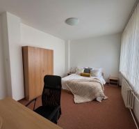 Bedroom in a 3-room apartment with a desk and a large window.