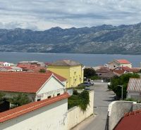 View of the coast and mountains in Ražanac from a family house with red roofs.