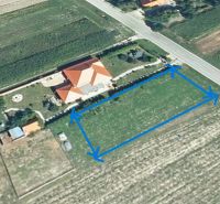 A plot for residential use in Kráľov Brod by the road, surrounded by agricultural land.