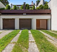Garages of a family house on Talichova Street in Bratislava - Dúbravka with a green roof.