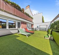 A terrace with artificial grass and loungers at a family house in Bratislava, Dúbravka on Talichova.