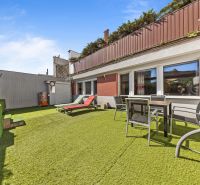 Terrace of a family house on Talichova Street in Bratislava - Dúbravka with artificial grass.