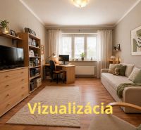 Living room in a 4-room apartment with a wooden decor floor and a comfortable sofa.