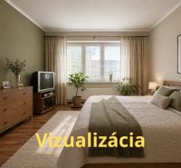 A bedroom with wood-decor flooring, a television, and a spacious bed in a 4-room apartment.