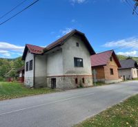 A family house in Stankovany with traditional architecture on a quiet street in nature.