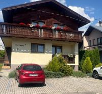 Wooden house with a balcony and parking in Liptovský Mikuláš.