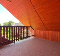 Attic terrace with a garden view in a family house in Polomka.