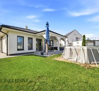 A family house in Veľké Blahovo, Dunajská Streda, with a lawn and an above-ground pool.