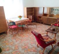 Living room in a family house with historical furnishings and wooden furniture.