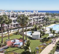 Palms, pool, and gardens in Pulpí holiday apartments with sea views.