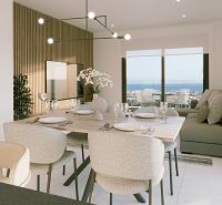 Dining area of a recreational apartment with a sea view and elegant table setting.