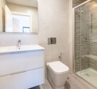Bathroom in a holiday apartment with a large shower and an elegant sink.