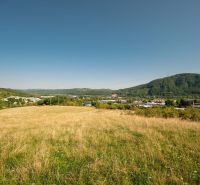 A landscape with meadows and hills on Partizánska cesta in Banská Bystrica, suitable for residential plots.
