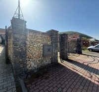 Stone gate and brick road in Banská Bystrica, Unusual properties.