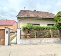 A family house on Krajinská Street in Bratislava - Podunajské Biskupice with a fence and a front garden.