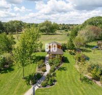 A garden at a family house in Bílkové Humence with a gazebo in a landscaped environment.