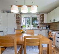 A kitchen in a family house with wooden furniture and decorative accessories.