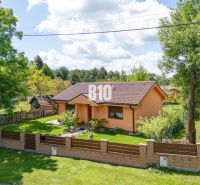 A family house in Bílkove Humence with a landscaped garden and terracotta facade.