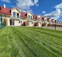 Family houses in Andovce with gardens and balconies, ideal for family living.