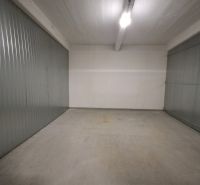 Interior of a space with metal walls and concrete floor.