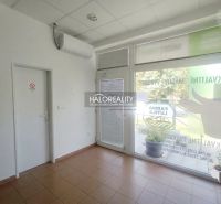 Commercial premises with tiles, air conditioning, and modern glass doors.