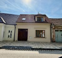 A family house on Pekárska Street in Trnava with a brick facade and a courtyard.
